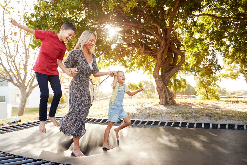 family playing on a trampoline